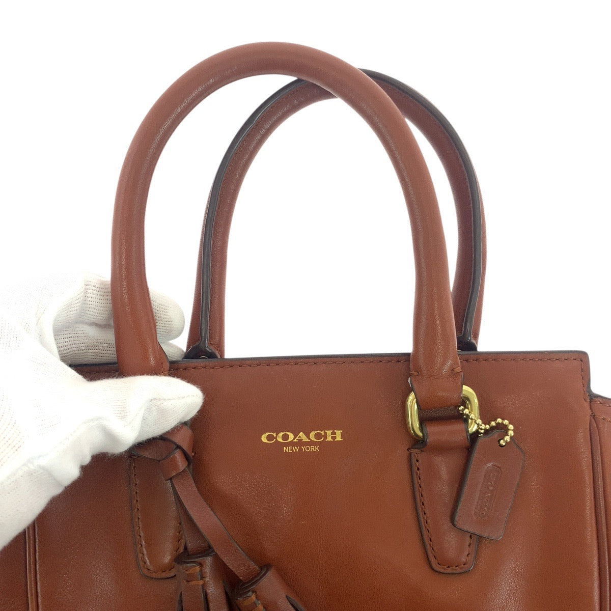 18777
COACH コーチ タッセル ブラウン ゴールド金具 レザー トートバッグ ハンドバッグ レディース AB6