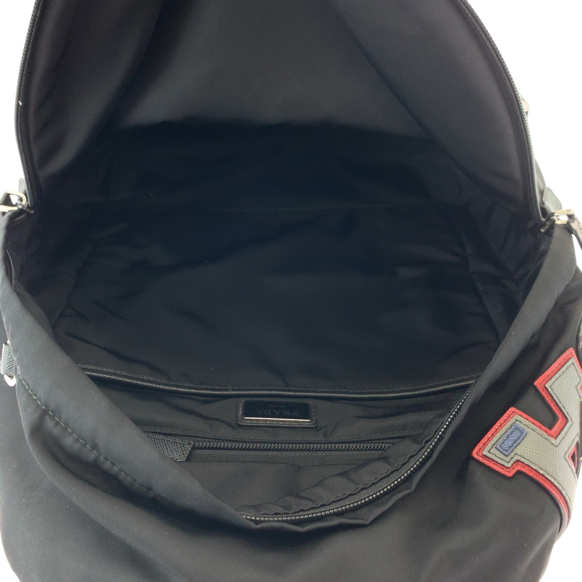 17127
PRADA プラダ テスート ロゴパッチ ブラック 黒 マルチカラー シルバー金具 ナイロン 2VZ135 リュックサック バックパック  メンズ ABP74