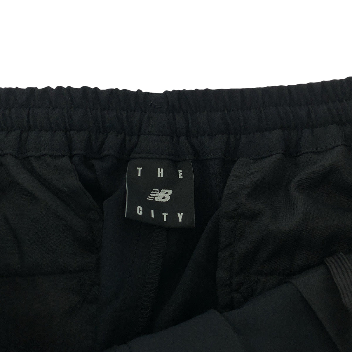 17719
NEW BALANCE ニューバランス THE CITY サイズXL ブラック 黒 ポリエステル JMPL 1903 パンツ テーパードパンツ  メンズ