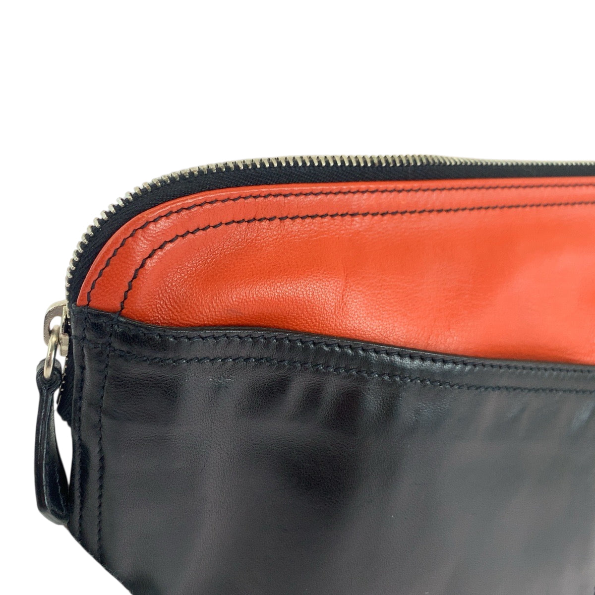 18637
PRADA プラダ 三角ロゴプレート 男女兼用 ブラック オレンジ シルバー金具 レザー クラッチバッグ セカンドバッグ レディース ABP22