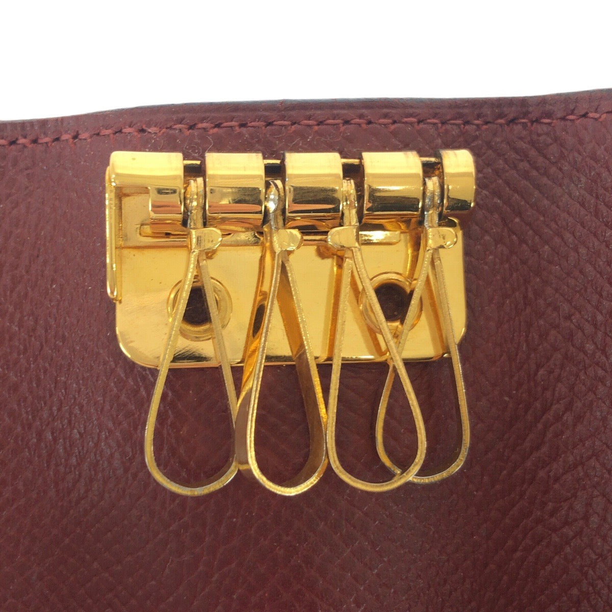 21067
HERMES エルメス ワインレッド ボルドー ゴールド金具 レザー キーケース 4連 男女兼用 レディース ABP20