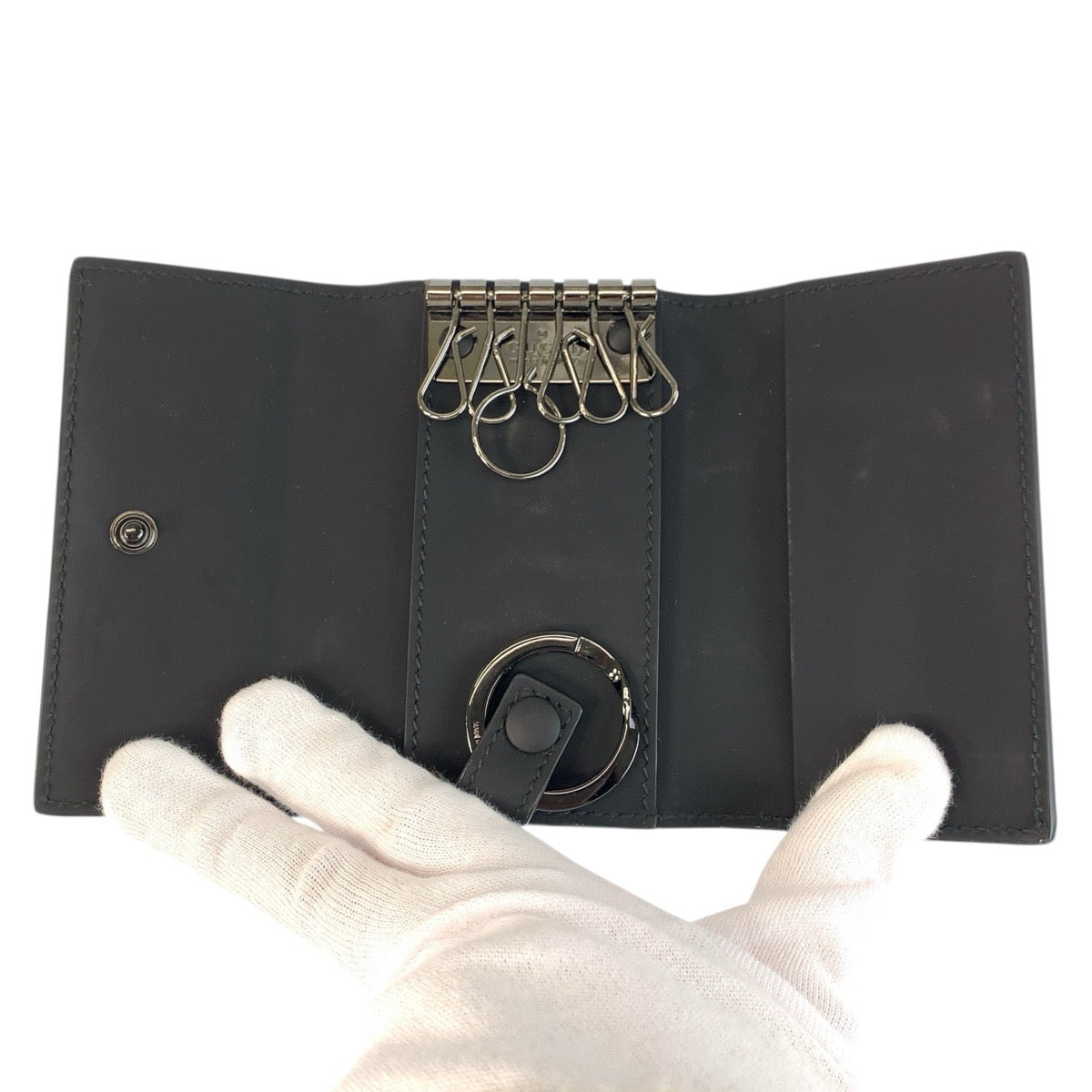 21957
GUCCI グッチ ラバーエフェクト ブラック 黒 レザー 771312 キーケース 6連 メンズ ABP20