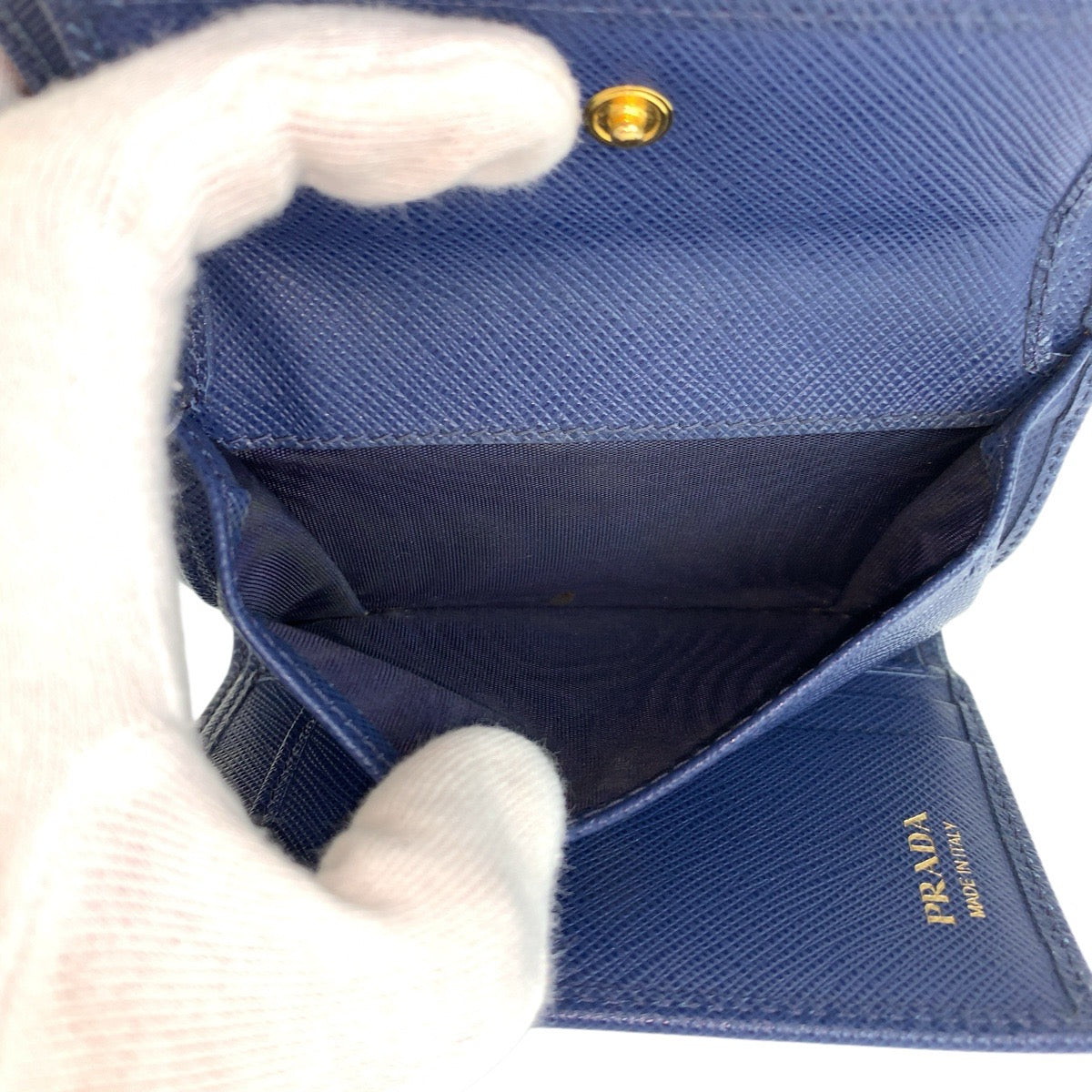 23874
PRADA プラダ サフィアーノ フィオッコ リボン ネイビー ゴールド金具 レザー 折り財布 コンパクトウォレット レディース AB21