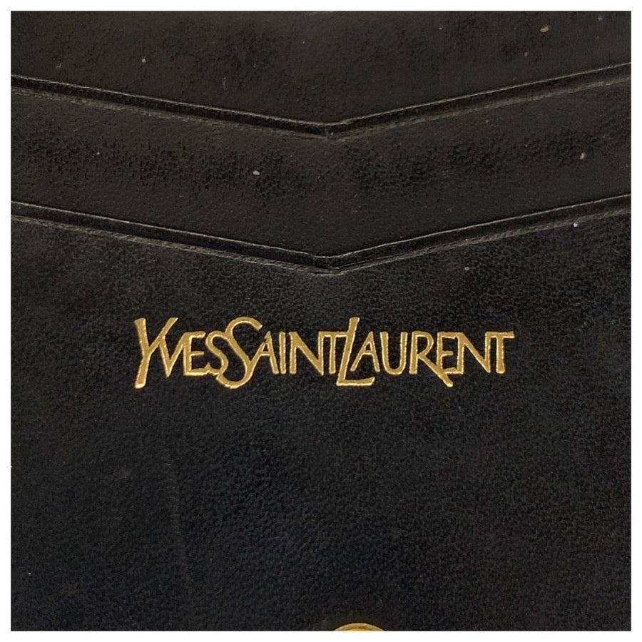 24683
YVES SAINT LAURENT イヴ サンローラン ロゴ 型押し ブラック 黒 レザー 折財布 コンパクトウォレット レディース AB9