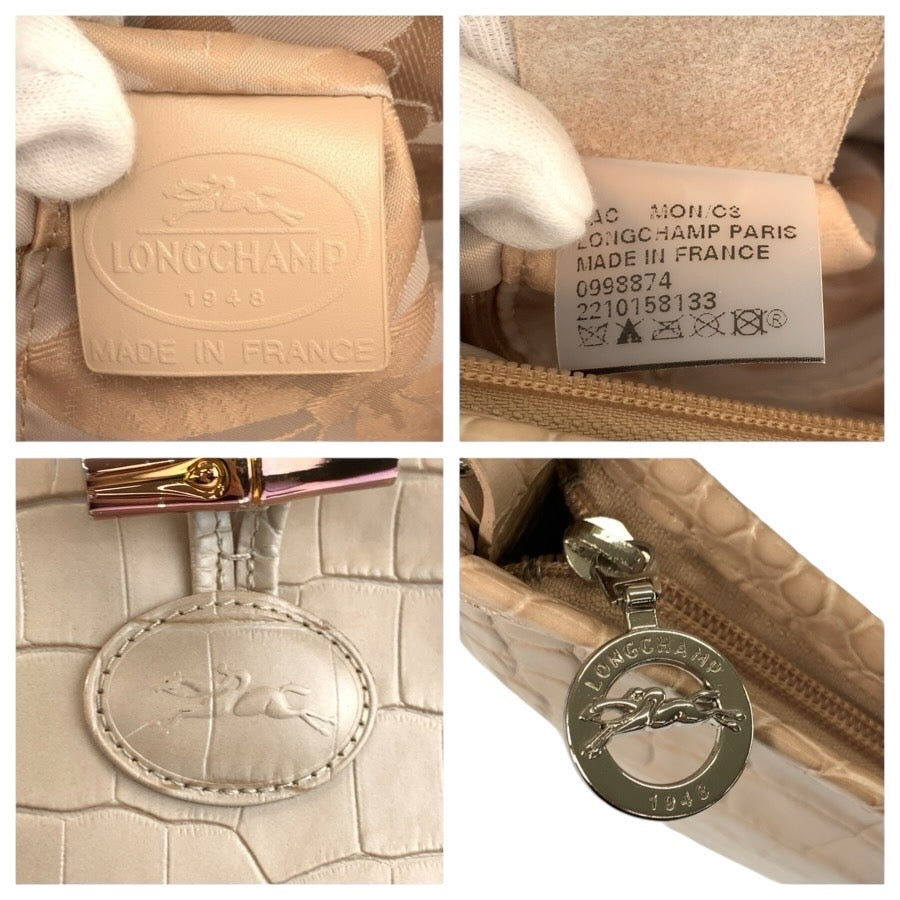 24803
Longchamp ロンシャン 型押し ベージュ レザー 2210158133 ショルダーバッグ ポシェット レディース ABP15