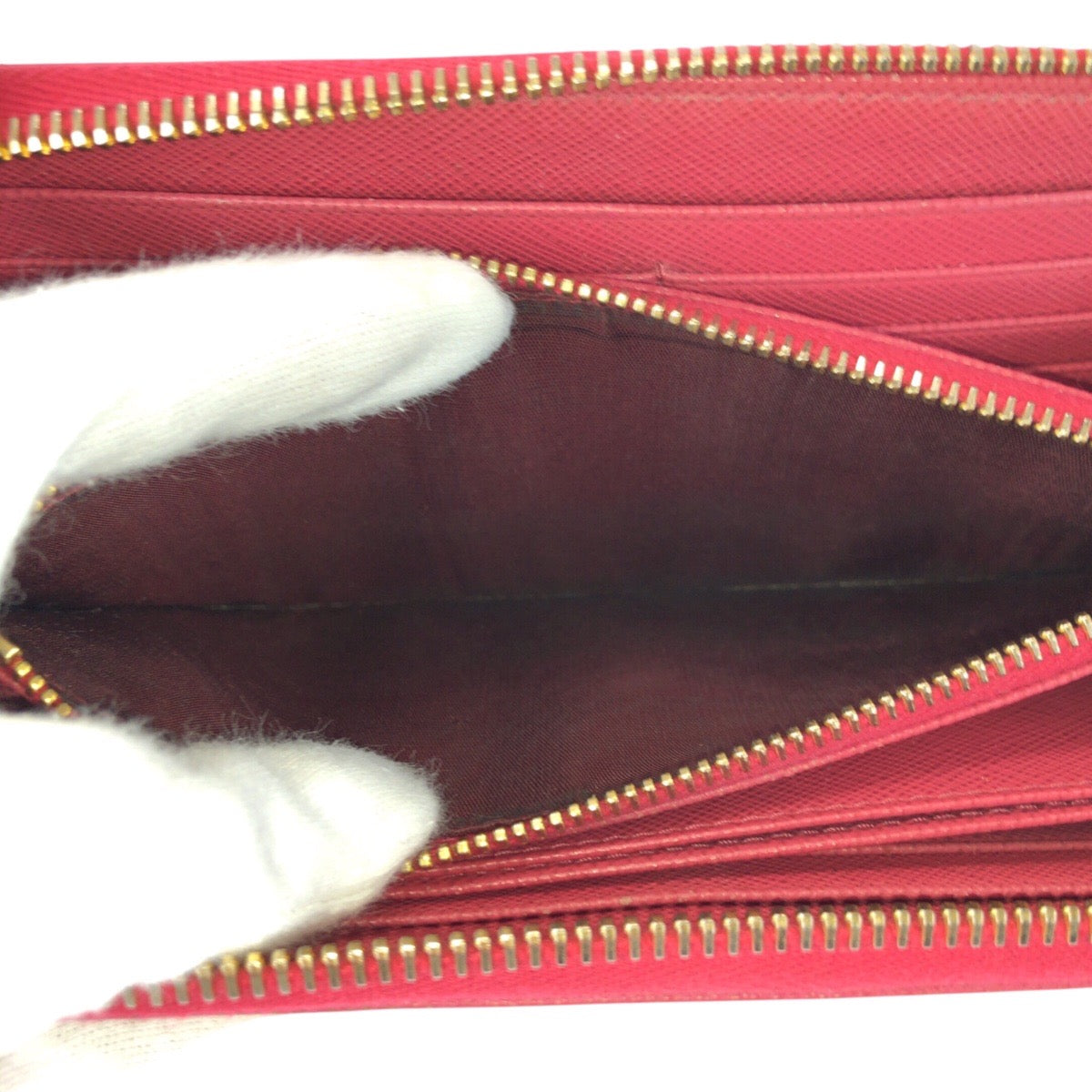 24868
PRADA プラダ サフィアーノ 三角ロゴプレート ピンク ゴールド金具 レザー 長財布 ラウンドファスナー レディース AB16