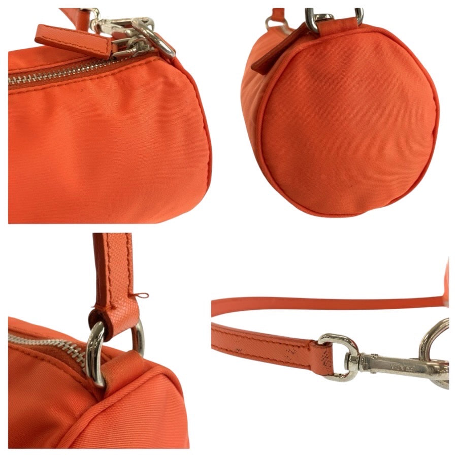25309
PRADA プラダ テスート 三角ロゴプレート オレンジ シルバー金具 ナイロン ハンドバッグ アクセサリーポーチ レディース ABP42