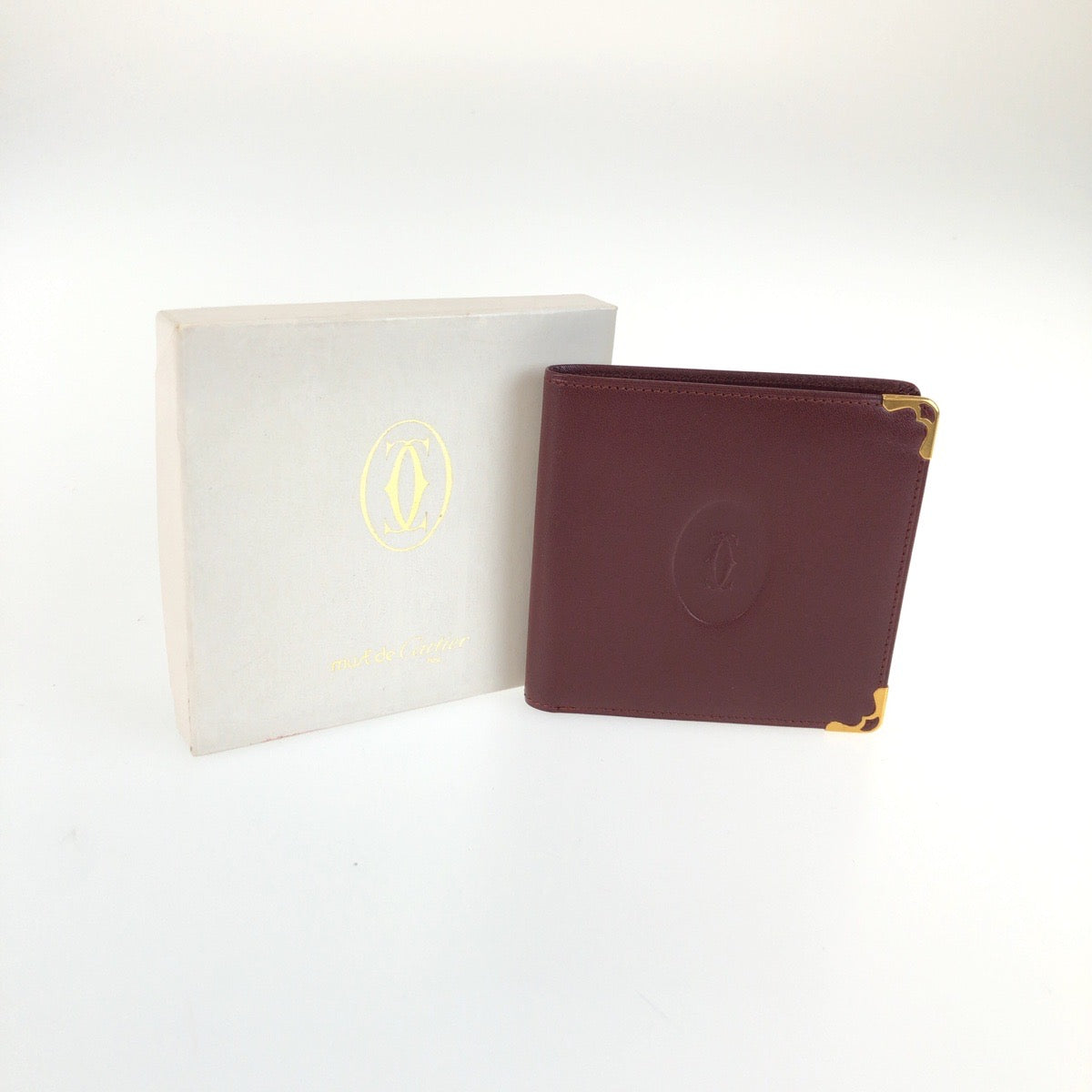 25596
CARTIER カルティエ マストライン ワインレッド ゴールド金具 レザー 札入れ コンパクトウォレット メンズ A10