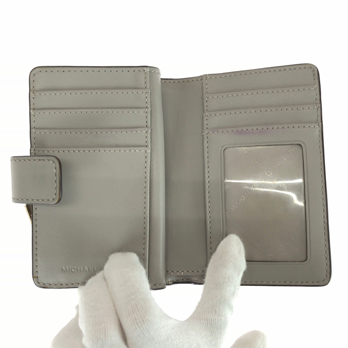 25988
Michael Kors マイケルコース JET SET TRAVEL ホワイト グレー ゴールド金具 PVC 35F8GTVF2B 折財布 コンパクトウォレット レディース ABP3