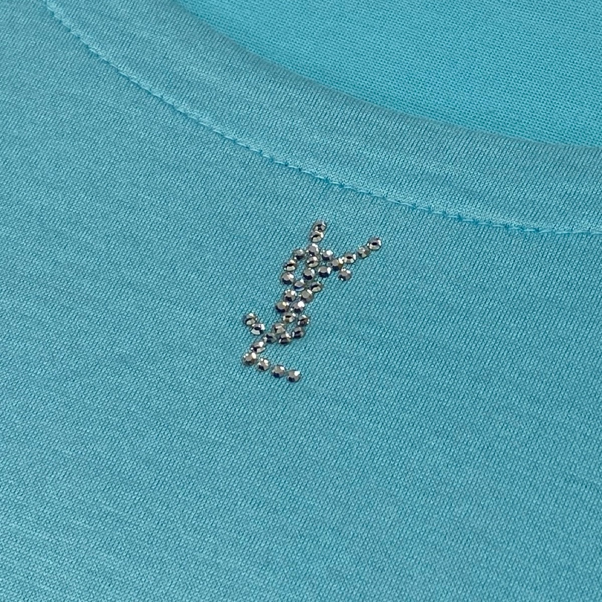 YVES SAINT LAURENT イヴ サンローラン ラインストーンカサンドラロゴ ブルー ライトブルー コットン 半袖Ｔシャツ レディース B