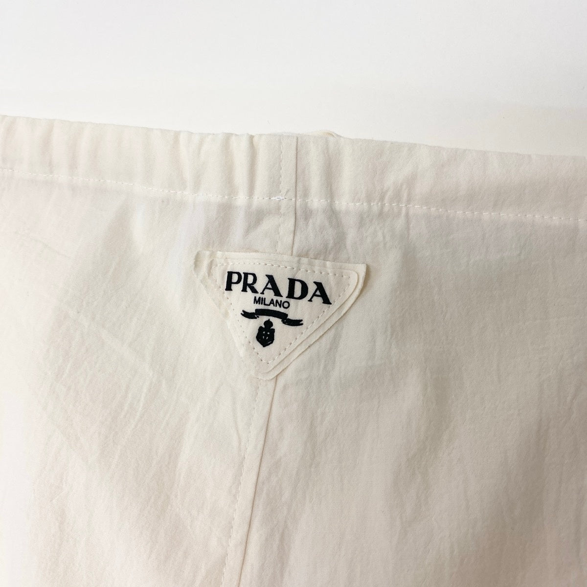 PRADA プラダ トライアングルロゴ ウエスト調節可◎ アイボリー コットン コットンパンツ メンズ AB